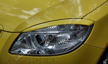 Накладки на фари Skoda Roomster фото